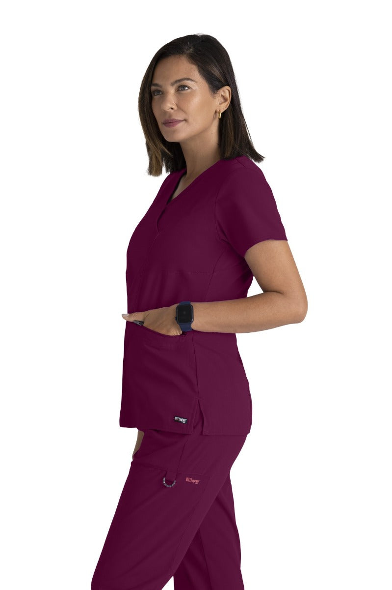 Greys Anatomy V-Neck Kim Top with Zip Front Pocket | Wine