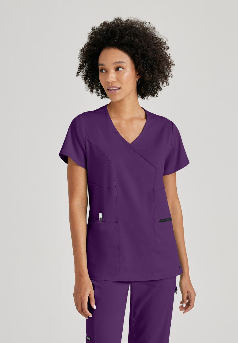 Greys Anatomy V-Neck Kim Top with Zip Front Pocket | Eggplant