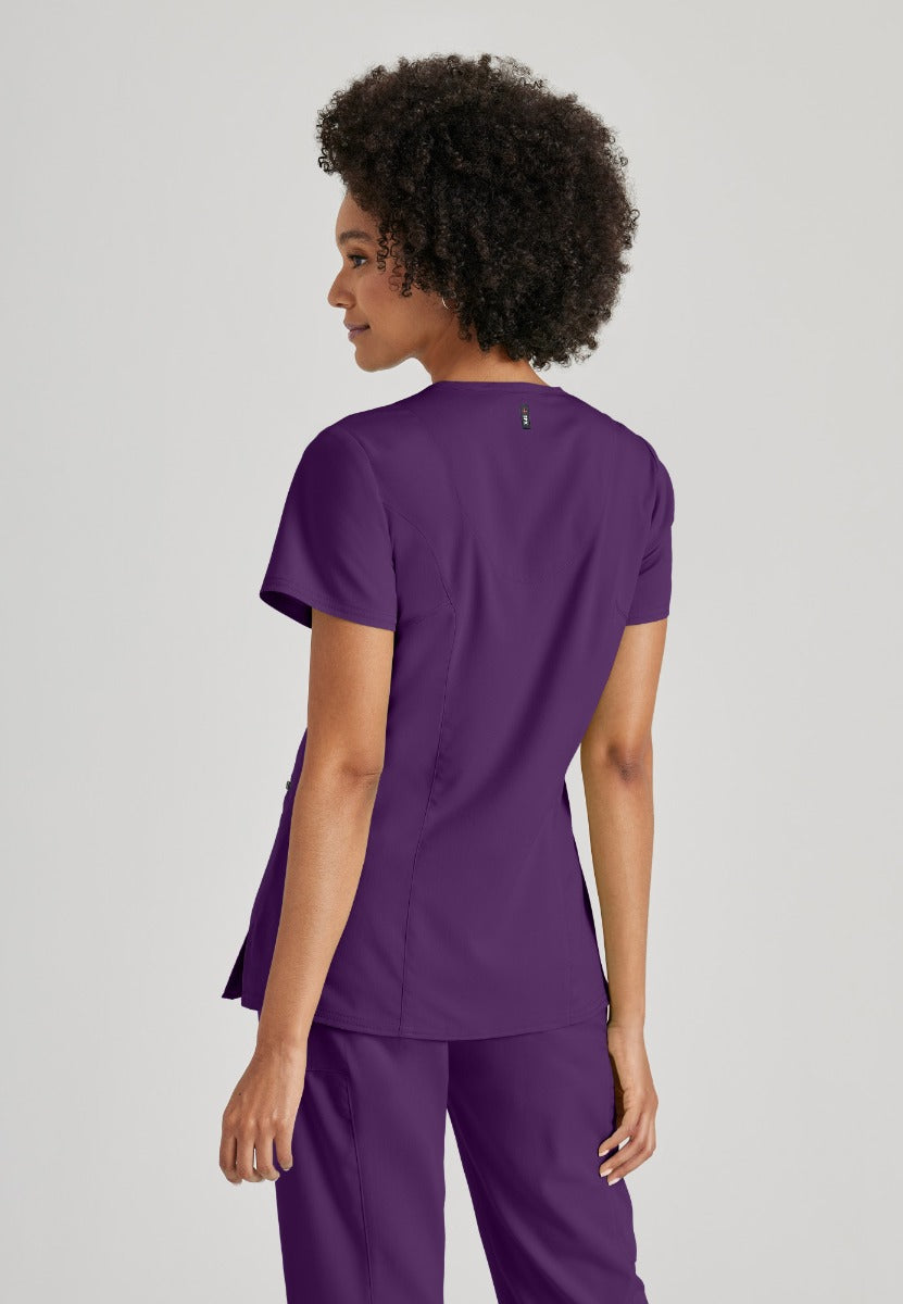 Greys Anatomy V-Neck Kim Top with Zip Front Pocket | Eggplant