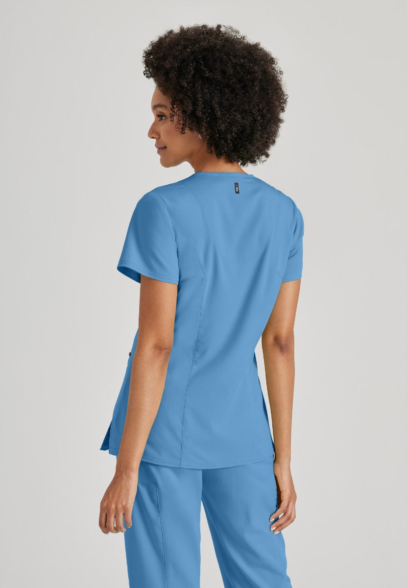 Greys Anatomy V-Neck Kim Top with Zip Front Pocket | TRUE CEIL