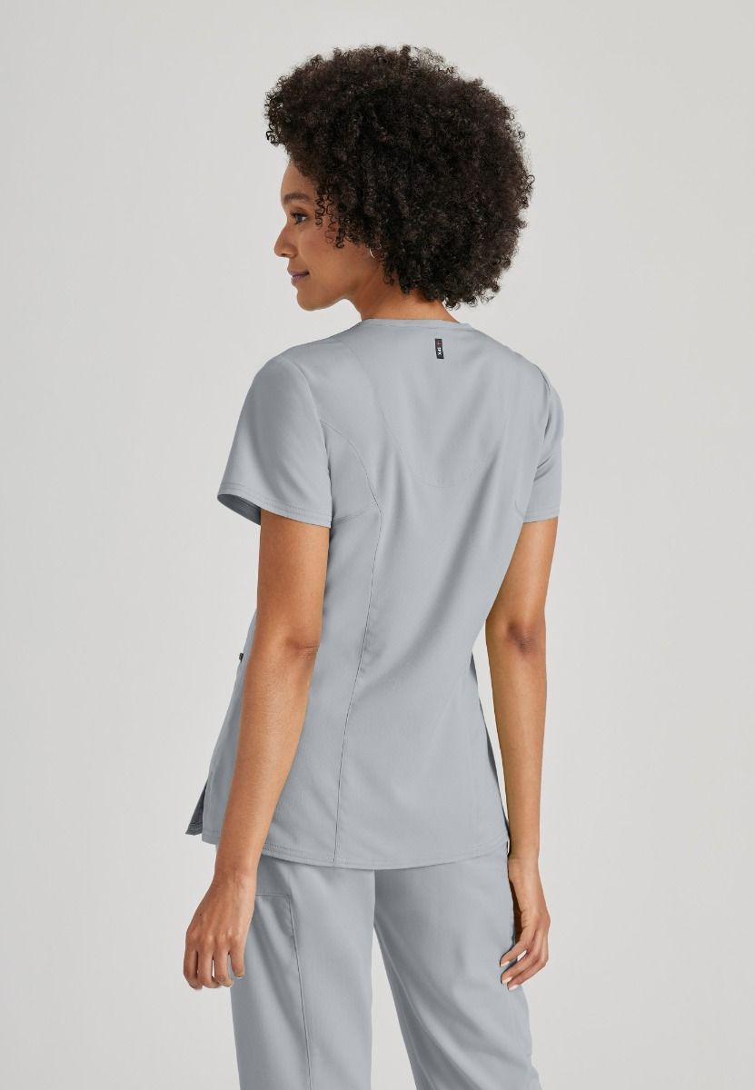 Greys Anatomy V-Neck Kim Top with Zip Front Pocket |  Moonstruck