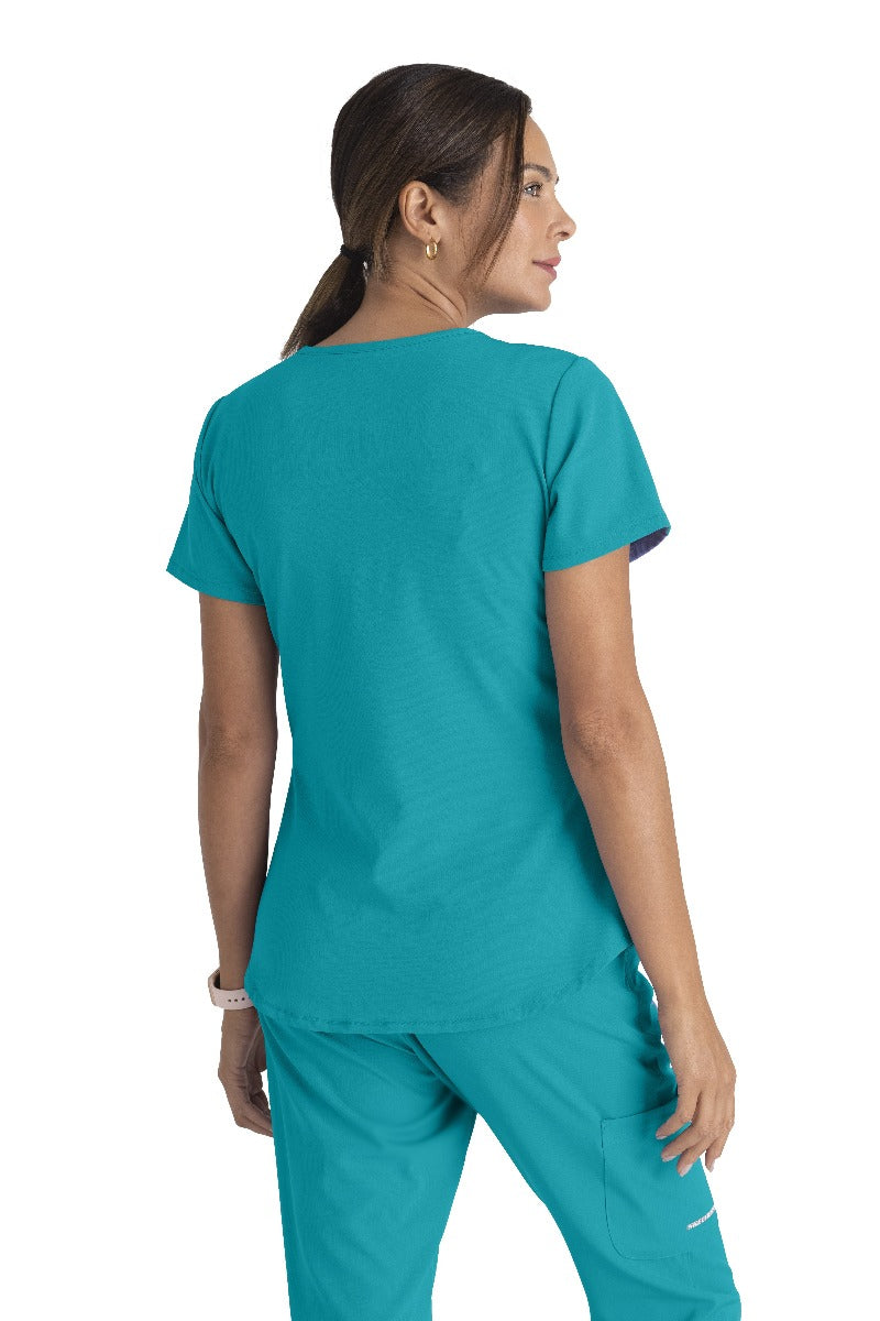 SKECHERS BREEZE 3-POCKET SHAPED HEM TOP | Teal