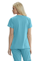 SKECHERS FEMALE RELIANCE 3-POCKET WRAP EFFECT TOP | TURQUOISE