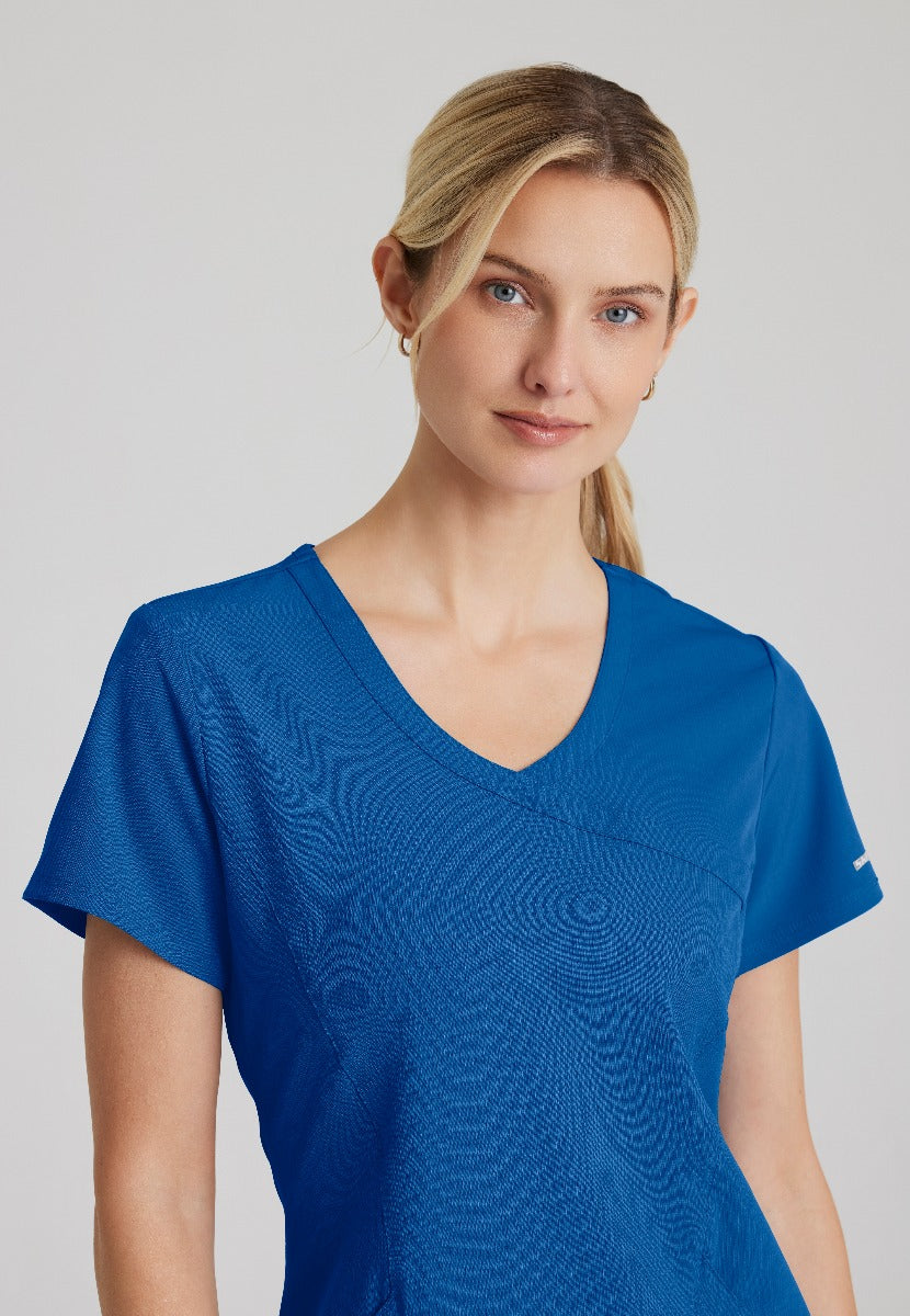 SKECHERS FEMALE RELIANCE 3-POCKET WRAP EFFECT TOP | New Royal