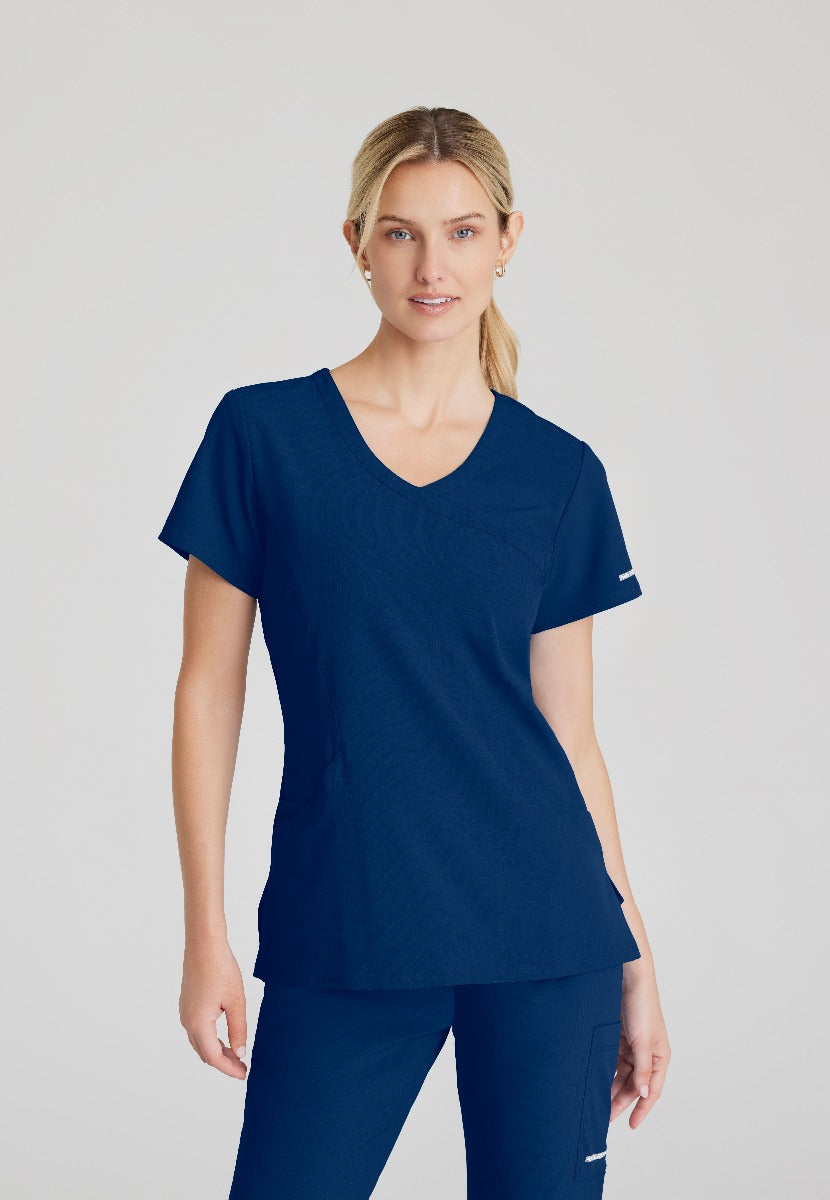 SKECHERS FEMALE RELIANCE 3-POCKET WRAP EFFECT TOP | NAVY